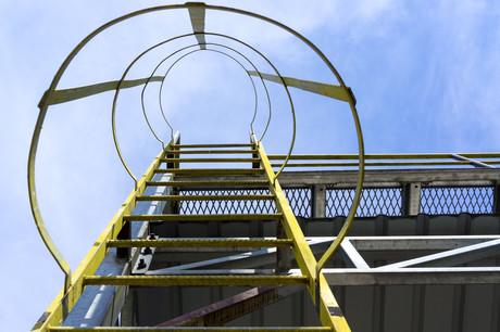 Preventing falls from fixed ladders with cages