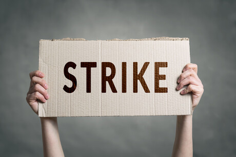 Teacher pay docked over five-minute strike