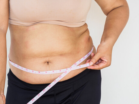 Why do our waistlines expand in middle age?