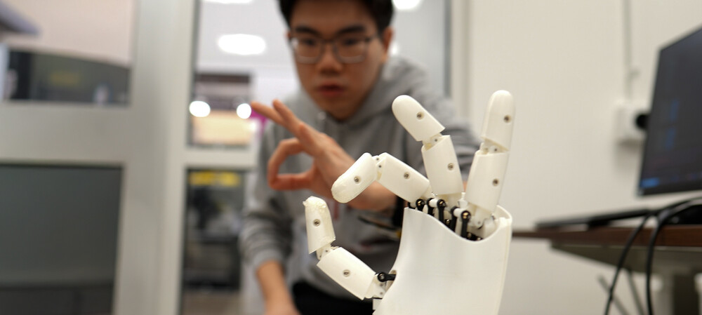 Ultrasound wristband enables precise robotic hand control
