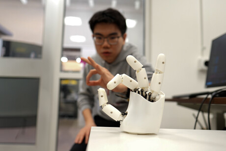 Ultrasound wristband enables precise robotic hand control